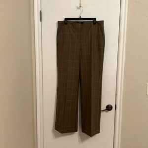 Slacks with four pockets, cuffed. Brown, rust and beige pattern. Lightly worn.